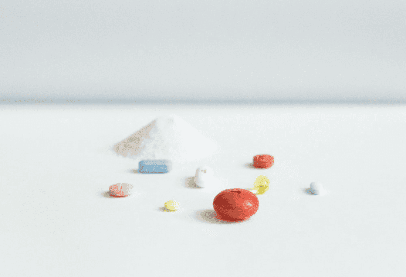 White powder alongside tablets and capsules